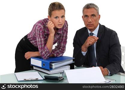 Businessman working with his assistant