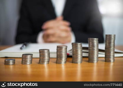 Businessman working with income statement document on the wood table.Business concept.