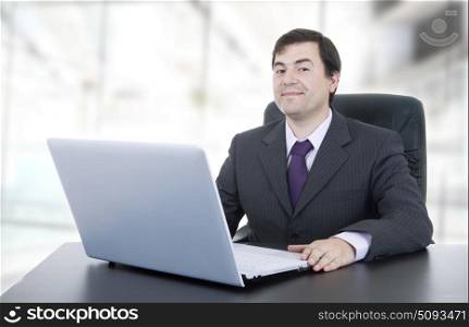 businessman working with is laptop, at the office