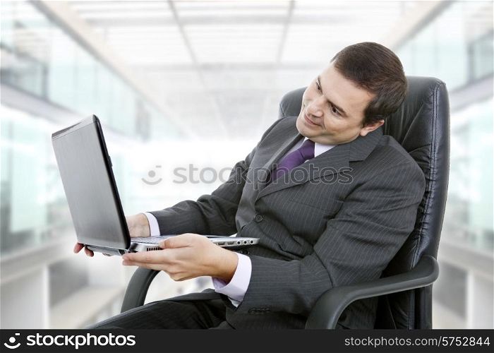 businessman working with is laptop, at the office