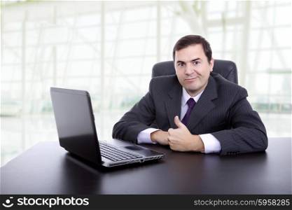businessman working with is laptop at the office