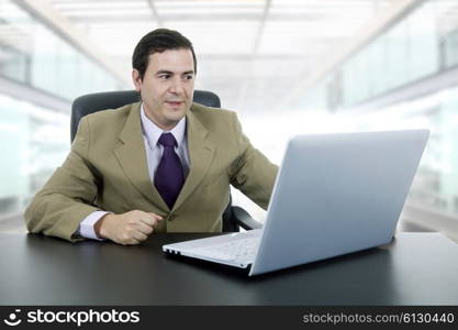 businessman working with is laptop, at the office