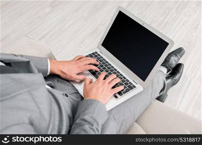 Businessman working with laptop in business concept