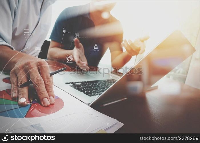 businessman working with mobile phone and digital tablet and laptop computer on wooden desk in modern office with VR icon diagram