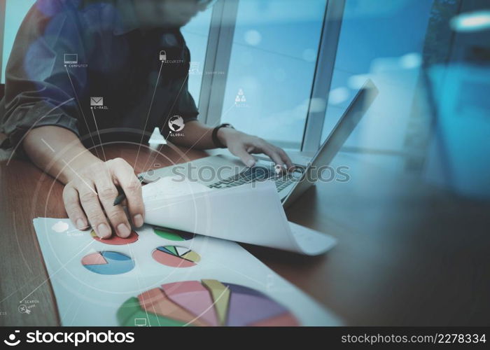 businessman working with mobile phone and digital tablet and laptop computer on wooden desk in modern office with virtual icon diagram