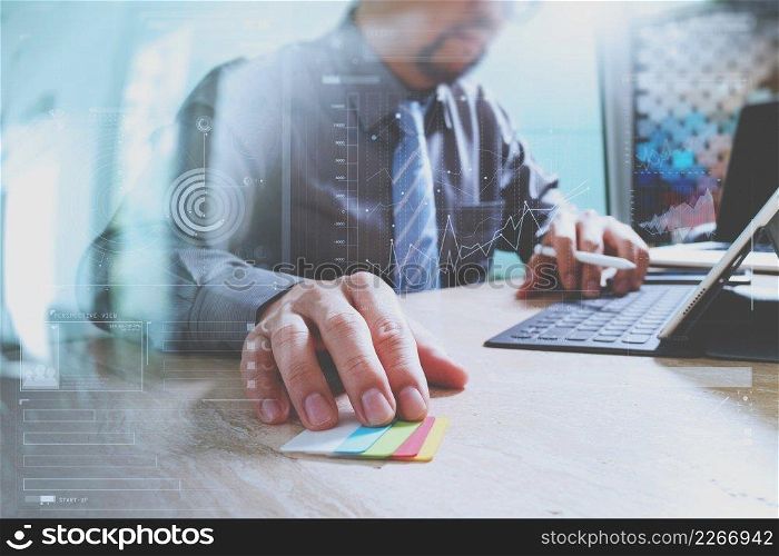 businessman working with new start up project.using smart phone digital tablet docking smart keyboard and laptop computer on marble desk,sun effect
