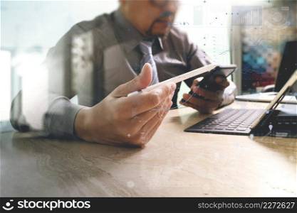 businessman working with new start up project.using smart phone digital tablet docking smart keyboard and laptop computer on marble desk,sun effect