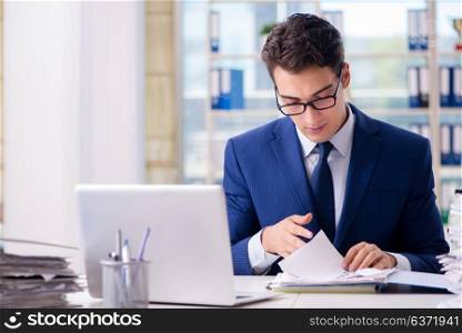 Businessman working with paperwork in the office