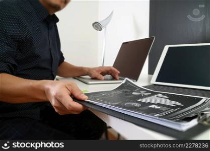 businessman working with smart phone and digital tablet and laptop computer and document in modern office