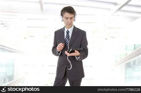 businessman working with tablet pc and headphones at the office