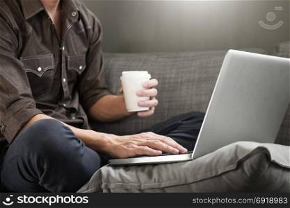 Businessman works on the sofa at home. Work searching for new idea creative and drinking hot coffee feeling think hard.