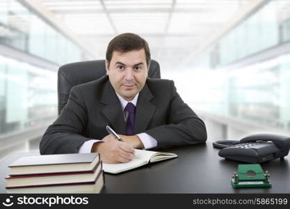 businessman writing on a desk at the office