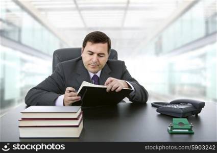 businessman writing on a desk, at the office