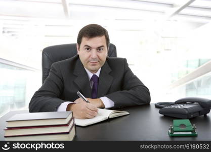 businessman writing on a desk, at the office