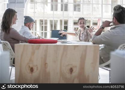 Businessmen and businesswomen brainstorming in loft office