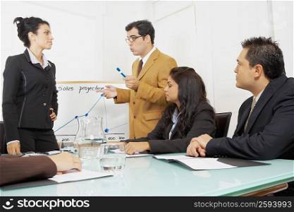 Businessmen and businesswomen in a conference room