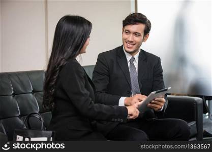 businessmen and group using notebook for business partners discussing documents and ideas at meeting and business women smiling happy for working