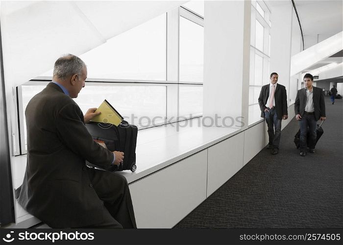 Businessmen at an airport lounge