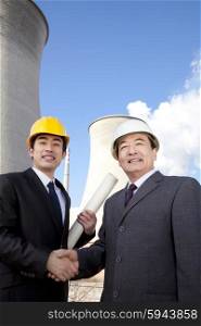 Businessmen at power plant
