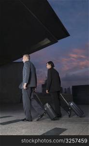 Businessmen carrying luggage