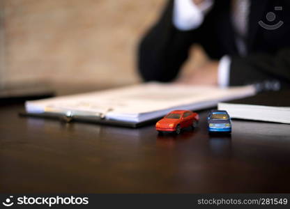 Businessmen contract on trading - rent a car. Businessmen insurance car concept.