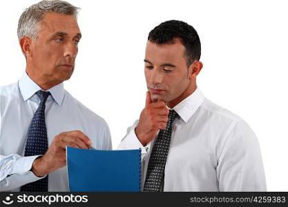 Businessmen discussing a document