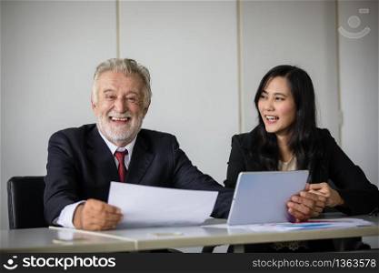businessmen holding documents for business partners discussing and share ideas at meeting and business women smiling happy for working