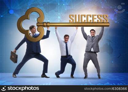 Businessmen holding giant key in business concept