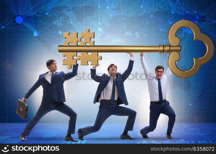 Businessmen holding giant key in business concept