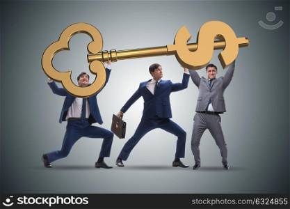 Businessmen holding giant key in finance concept