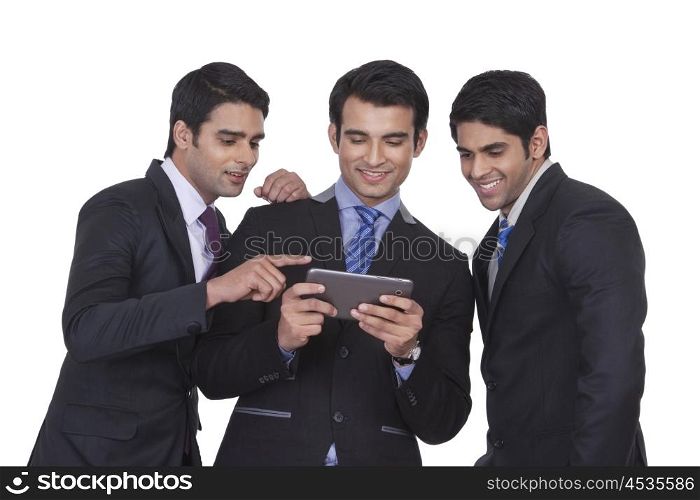 Businessmen looking at a mobile phone