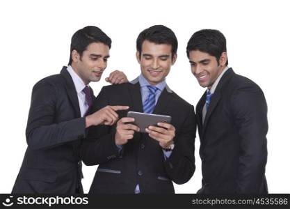 Businessmen looking at a mobile phone