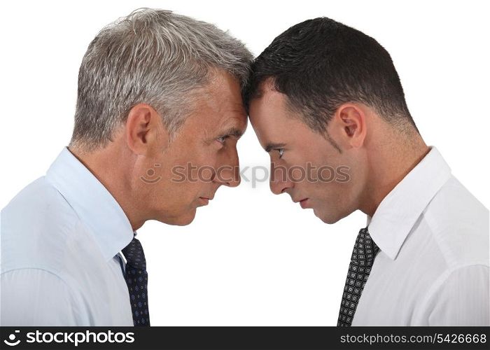 Businessmen stood head-to-head