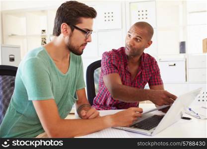 Businessmen Using Laptop In Office Of Start Up Business