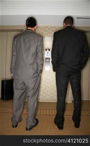 Businessmen Waiting for Elevator