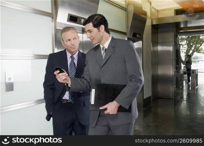 Businessmen walking in a corridor
