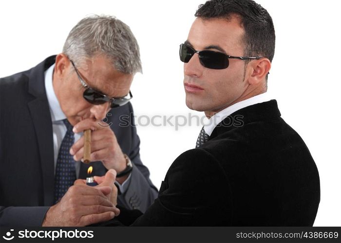 Businessmen wearing sunglasses