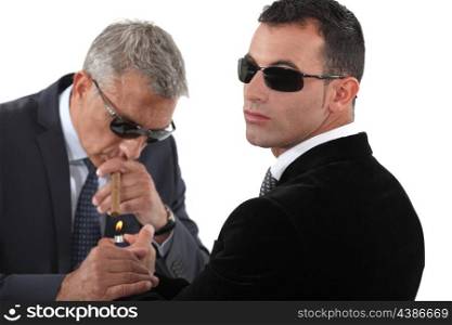 Businessmen wearing sunglasses