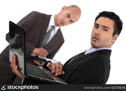 Businessmen with a diary and laptop