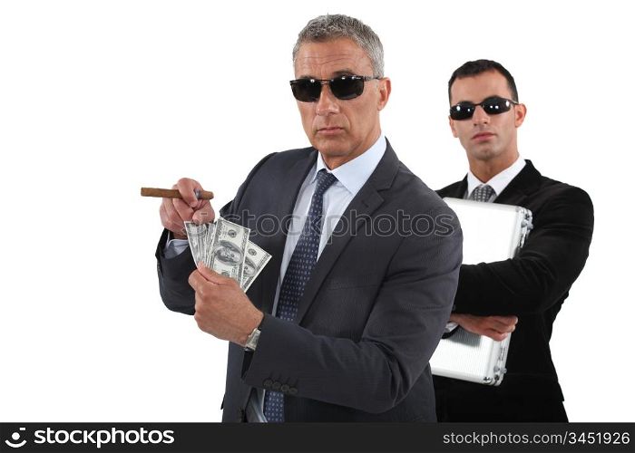 Businessmen with cash