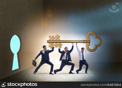 Businessmen with key having jigsaw puzzle elements
