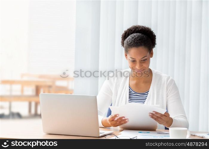 Businessowman working with papers in office