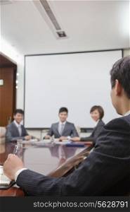 Businesspeople at a Meeting in a Conference Room