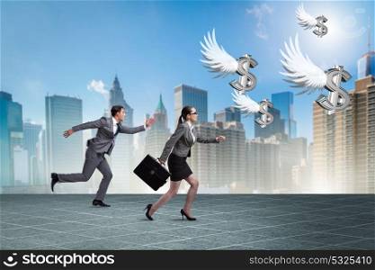 Businesspeople chasing angel investor funding