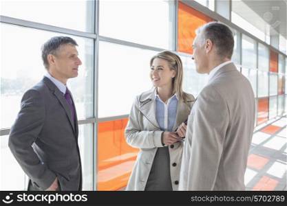 Businesspeople communicating on train platform
