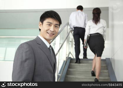 Businesspeople Going Up Stairs