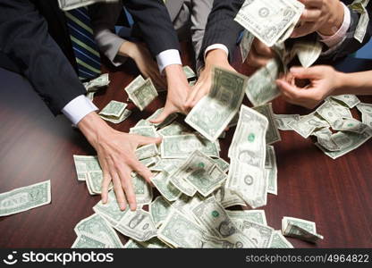 Businesspeople grabbing money