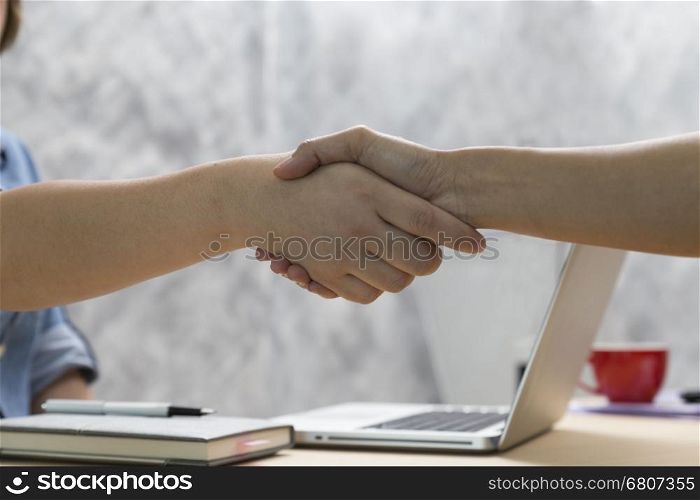 businesspeople handshaking for use as cooperation, acquisition, merger concept