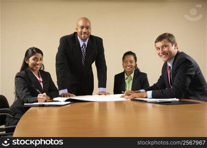 Businesspeople having meeting at conference table.