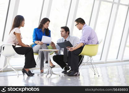 Businesspeople Having Meeting In Modern Office